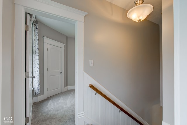 corridor with light colored carpet