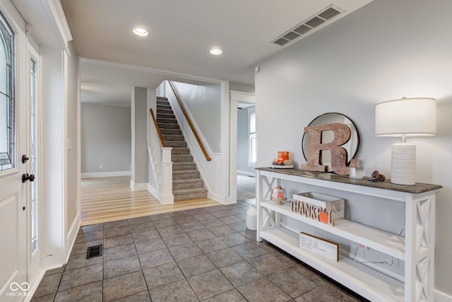 foyer with dark hardwood / wood-style floors