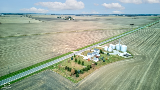 birds eye view of property with a rural view