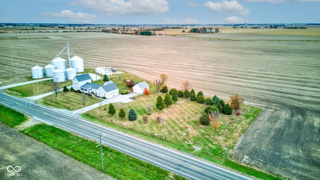 birds eye view of property with a rural view