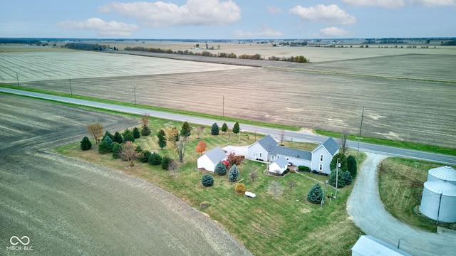 birds eye view of property with a rural view