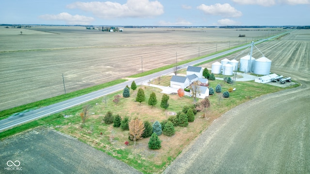 birds eye view of property with a rural view