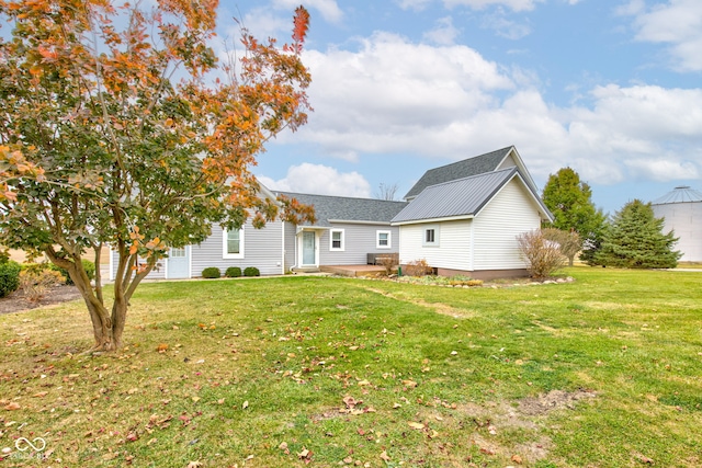 back of house featuring a yard and a patio area