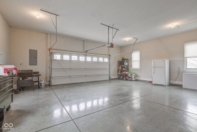 garage featuring a garage door opener, electric panel, and white fridge