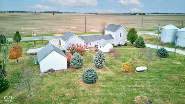 birds eye view of property with a rural view