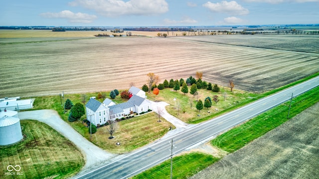 birds eye view of property with a rural view