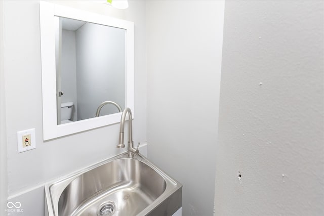 bathroom with sink and toilet