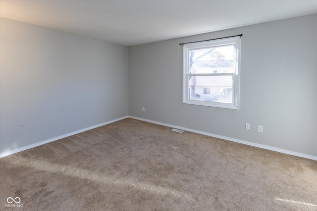 empty room featuring carpet flooring