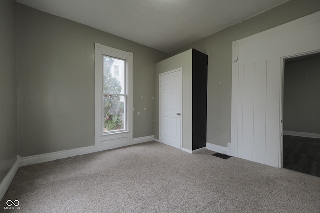 unfurnished bedroom featuring light colored carpet