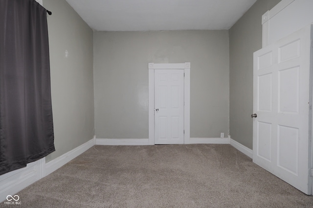 unfurnished room with carpet floors