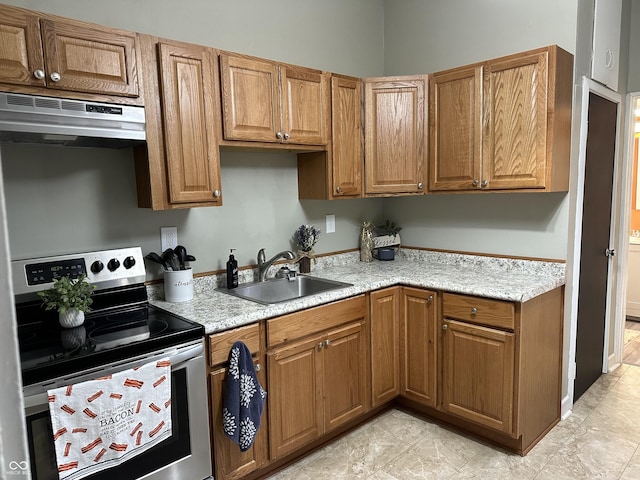 kitchen with light stone countertops, range hood, sink, and electric stove