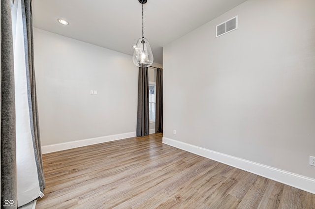 unfurnished dining area with light wood-type flooring