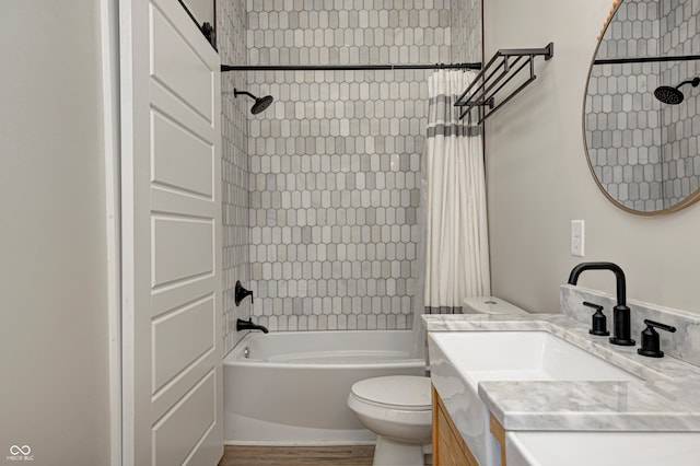 full bathroom featuring hardwood / wood-style floors, vanity, toilet, and shower / bath combination with curtain