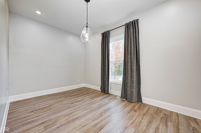 unfurnished room featuring light hardwood / wood-style flooring