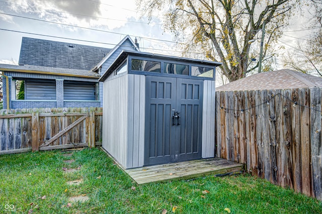 view of outbuilding featuring a lawn