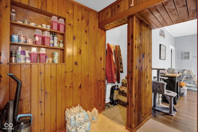 interior space with wood walls and light wood-type flooring