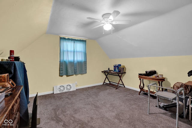 misc room with ceiling fan, carpet flooring, and vaulted ceiling