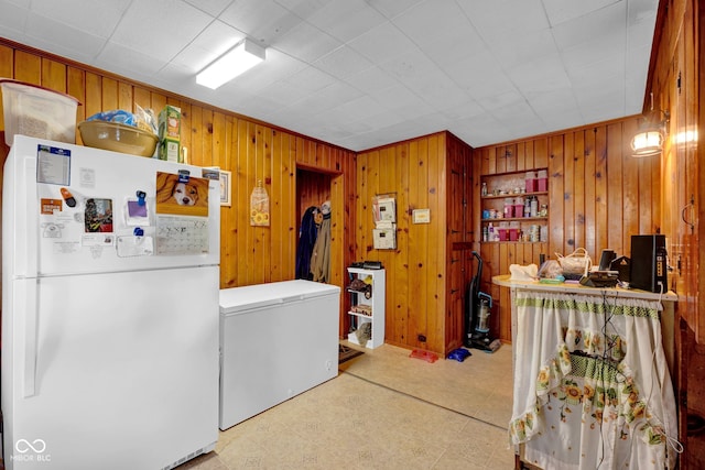 washroom featuring wood walls