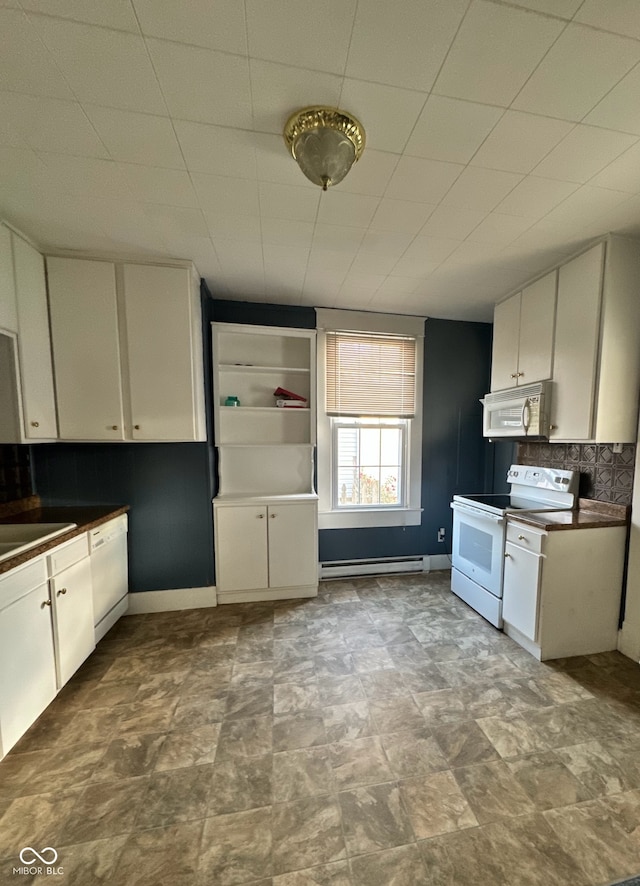 kitchen featuring white cabinetry, tasteful backsplash, white appliances, and a baseboard heating unit