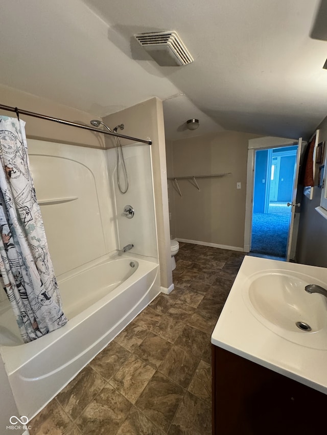 full bathroom featuring shower / tub combo with curtain, vanity, and toilet