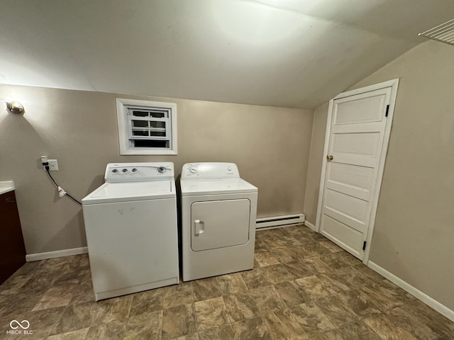 laundry room featuring washer and dryer and a baseboard heating unit