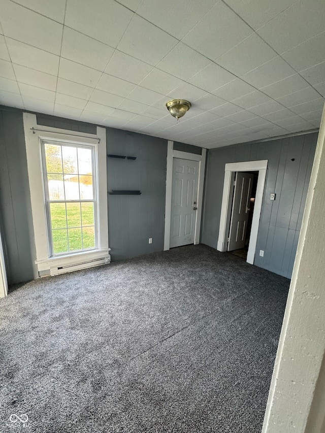 interior space with dark colored carpet