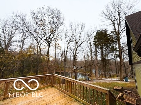 wooden terrace with a water view