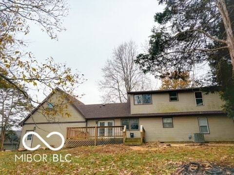 view of front of home featuring a deck and central air condition unit