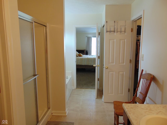 bathroom featuring vanity and separate shower and tub