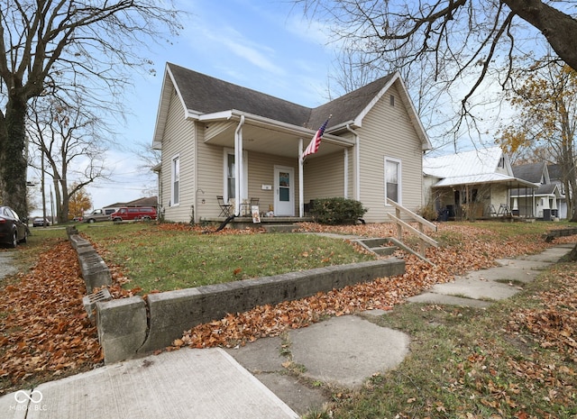 view of front of property with a front yard and a porch