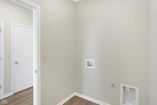 laundry room featuring hookup for a washing machine, wood-type flooring, and hookup for an electric dryer