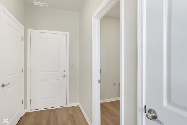 hall with light wood-type flooring