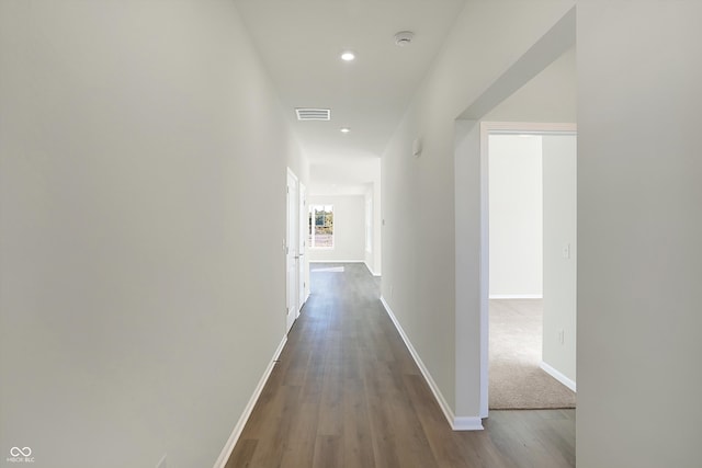 hall with hardwood / wood-style flooring