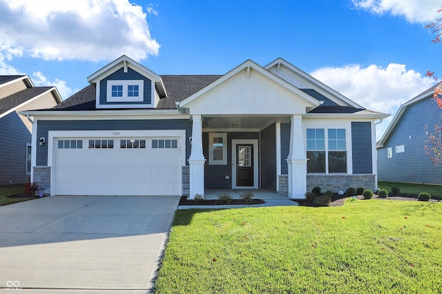 craftsman-style home with a garage and a front yard