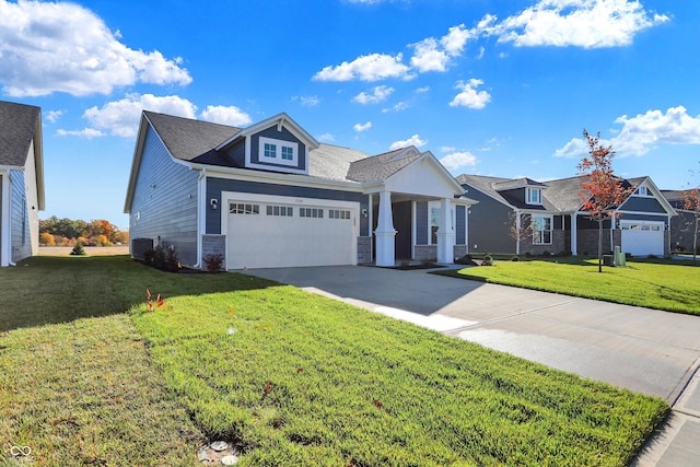 view of front of house featuring central air condition unit, a front yard, and a garage