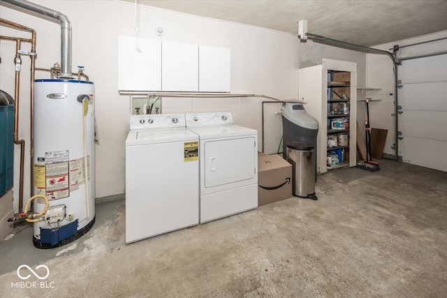 clothes washing area with water heater and separate washer and dryer