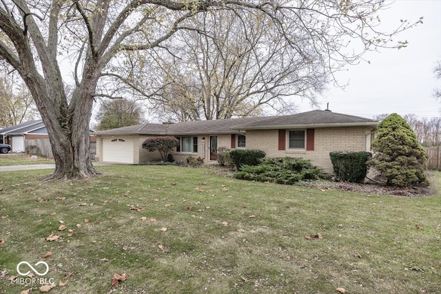 ranch-style house with a garage and a front yard