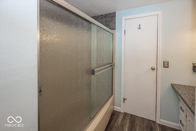 bathroom featuring vanity and hardwood / wood-style flooring