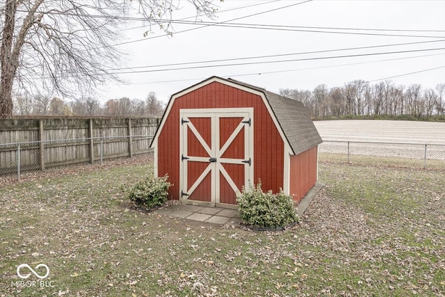 view of outbuilding with a lawn