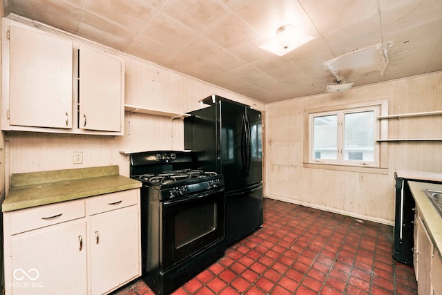 kitchen with white cabinets and black appliances