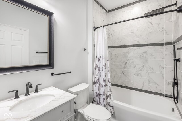 full bathroom with vanity, toilet, and shower / tub combo with curtain