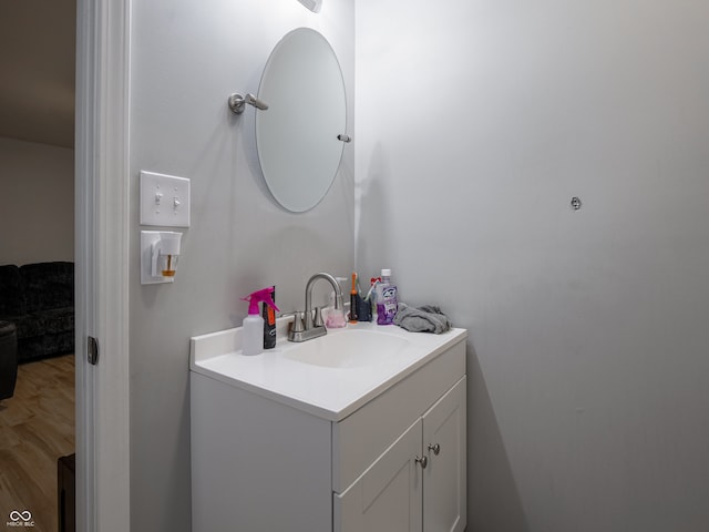 bathroom with vanity and wood-type flooring