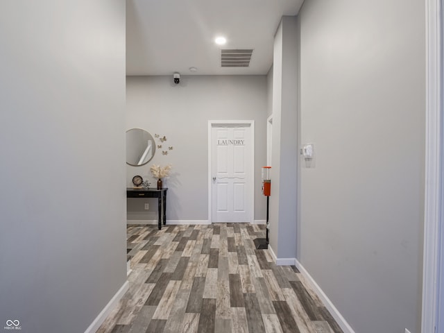 corridor featuring wood-type flooring