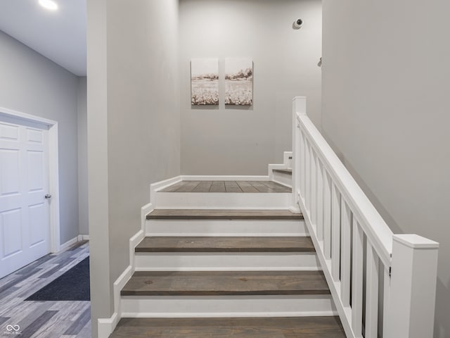 stairs with wood-type flooring