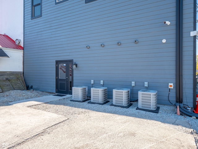 back of property featuring cooling unit