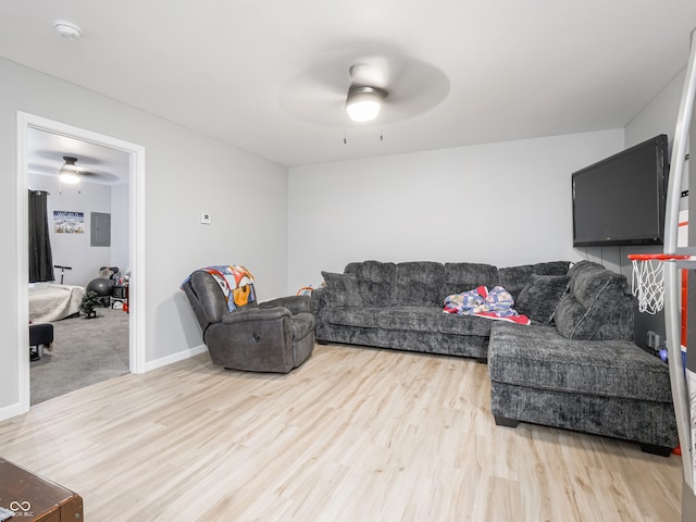 living room with wood-type flooring and ceiling fan