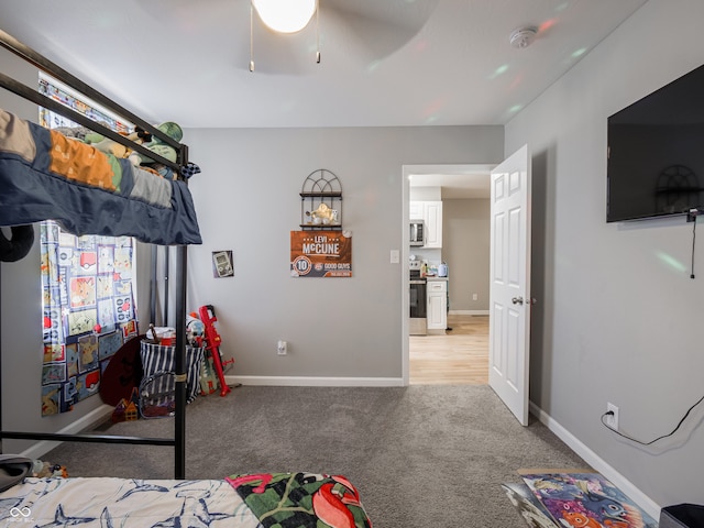 bedroom with light carpet and ceiling fan