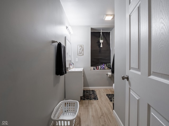 bathroom with vanity and hardwood / wood-style flooring