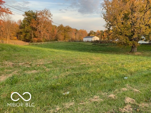 view of yard with a rural view