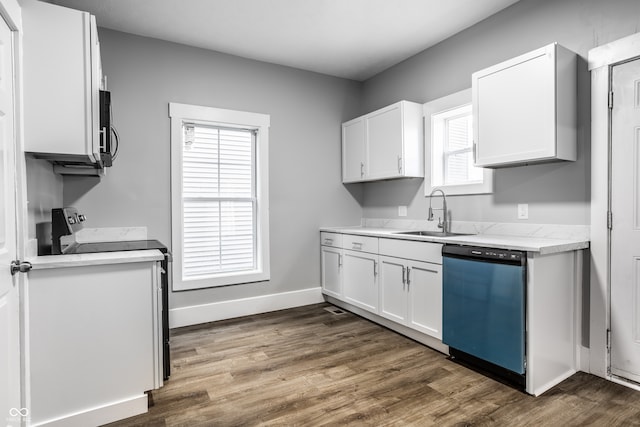 kitchen featuring sink, appliances with stainless steel finishes, light stone countertops, dark hardwood / wood-style floors, and white cabinets